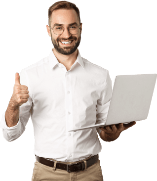 A Smiling Young Man Standing and Showing Thumbs Up While Working on a Laptop.