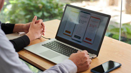 Two people discussing eCommerce plans on the table