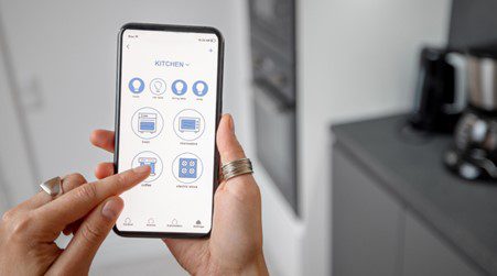 Women use smartphones for home automation.