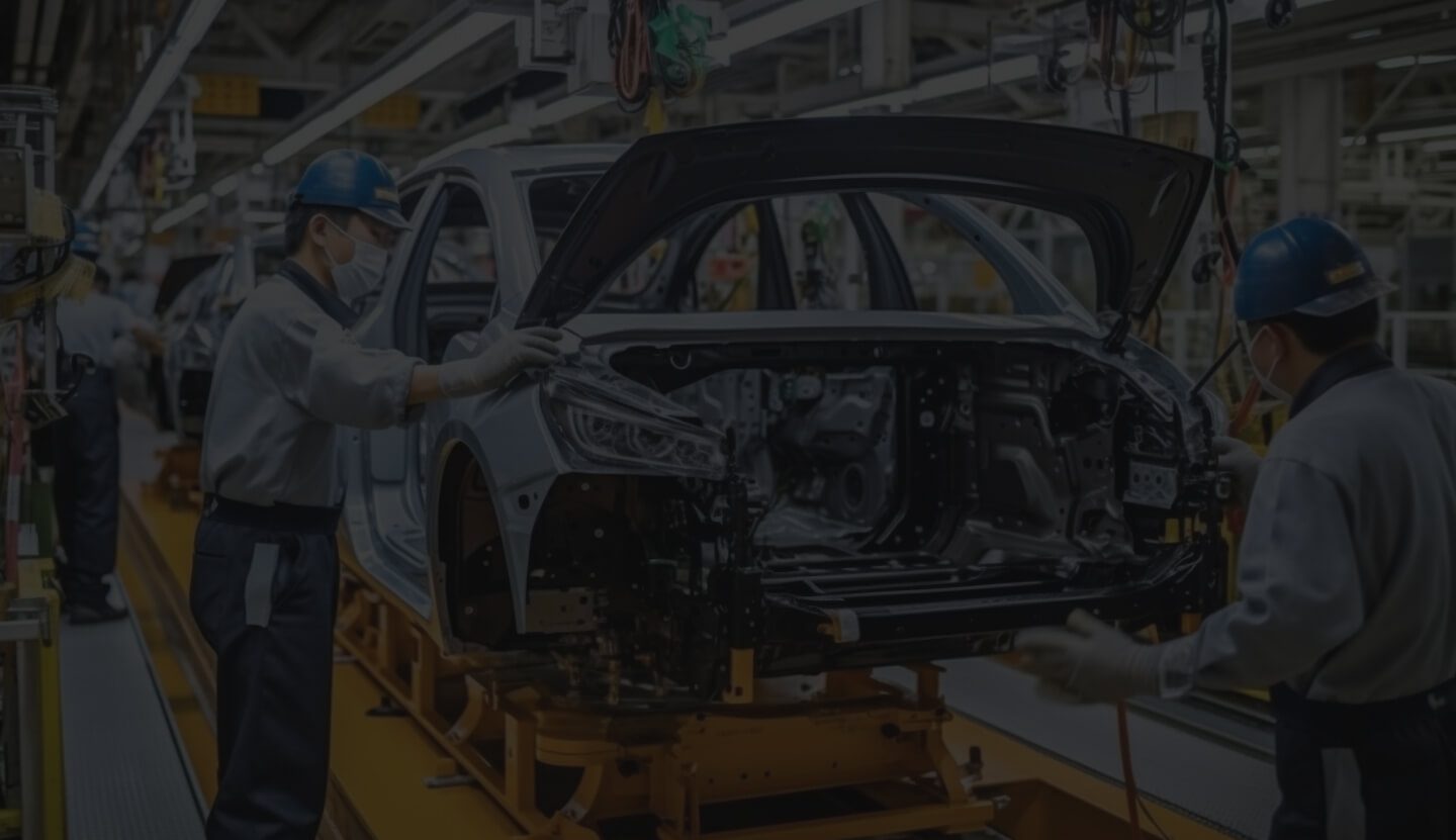 Car Manufacturing Assembly Line With Workers Assembling a Car.
