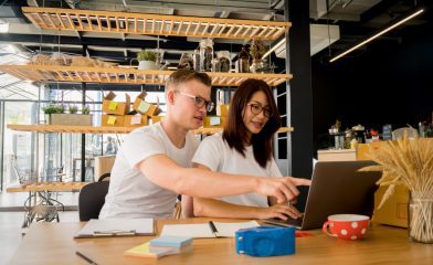 Two professionals working on custom ecommerce website design.