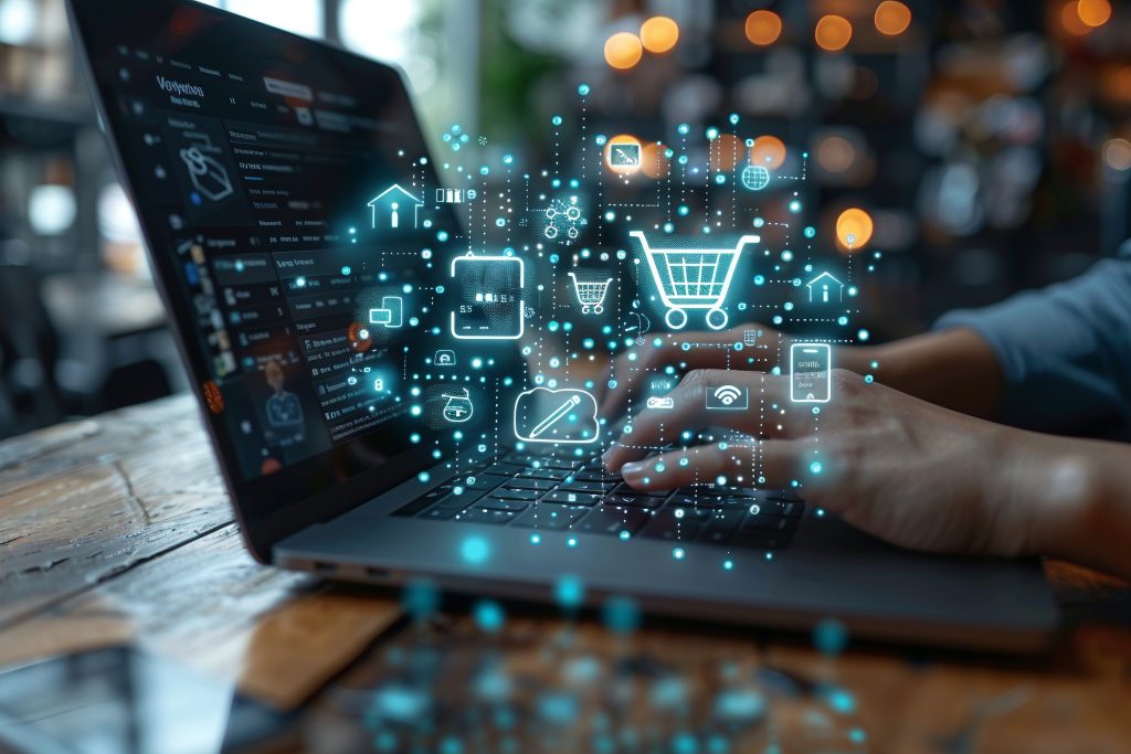 Hands typing on a laptop with ecommerce icons overlay.