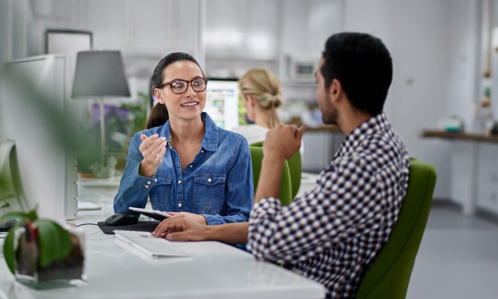 Two people are discussing about eCommerce platform integration services