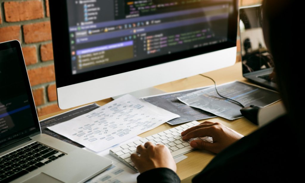Developer coding for custom ecommerce solutions.
