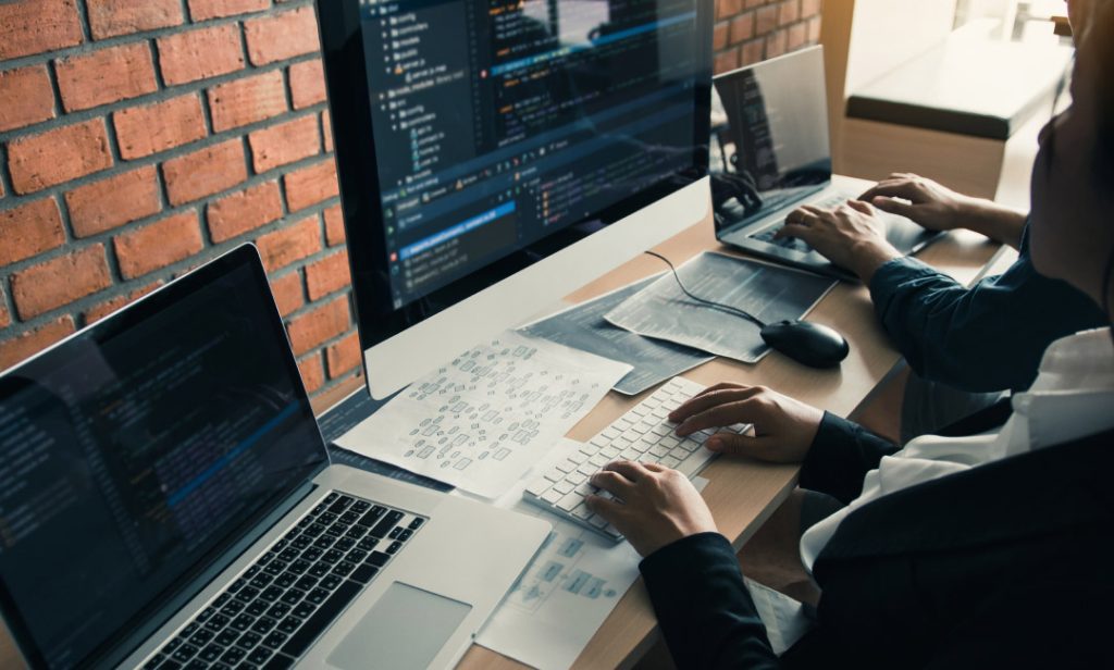 Two people discussing Custom eCommerce Development Solutions