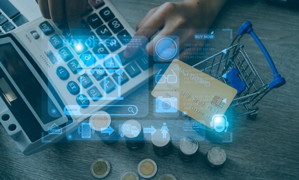 Image showcasing calculator, pen, coins, and shopping cart with credit card, representing B2B eCommerce solutions.