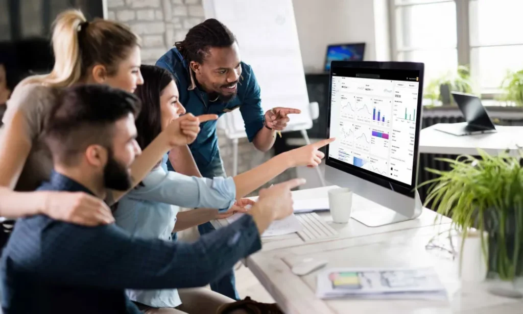 Shopify plus experts team analyzing data on a computer.