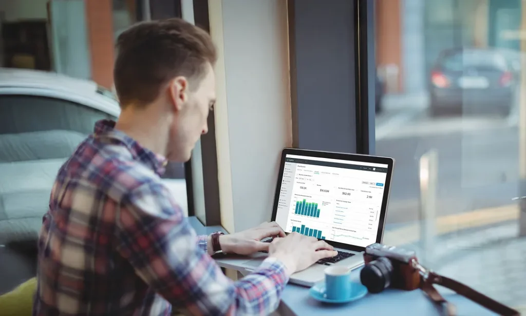 A young digital marketer setting up an email campaign in Klaviyo.