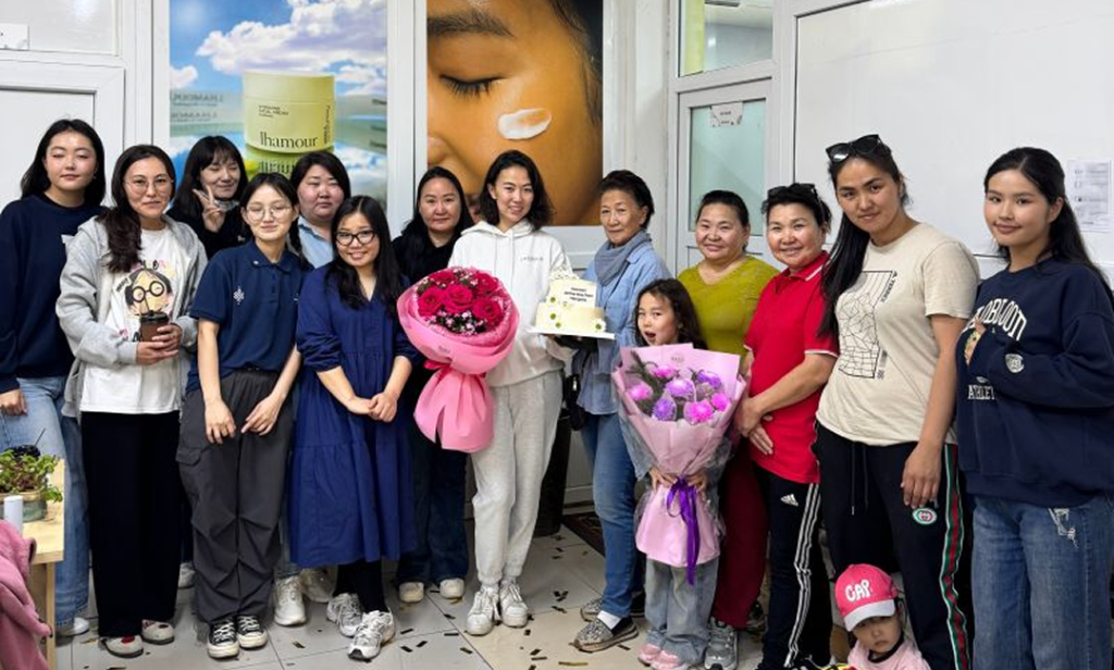 Khulan Davaadorj celebrates 10 years of Lhamour with her team.