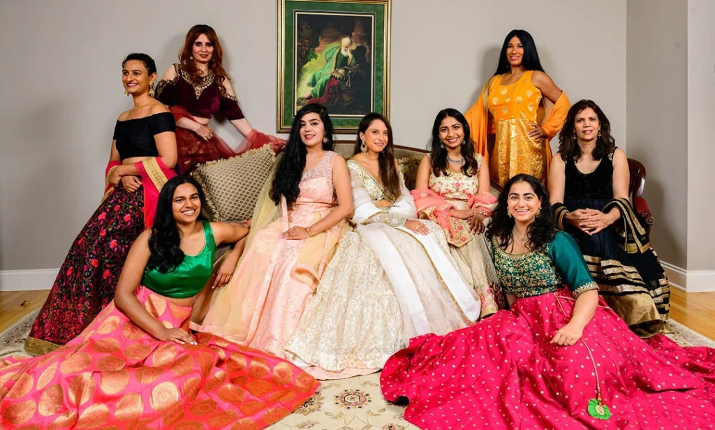 A group of women dressed in vibrant Indian outfits, celebrating sustainable fashion through Revare's inclusive resale marketplace.