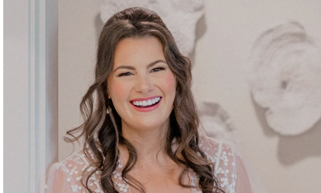 Alicia Valko, Founder and CEO of Claspe jewelry, smiling in a portrait photo.